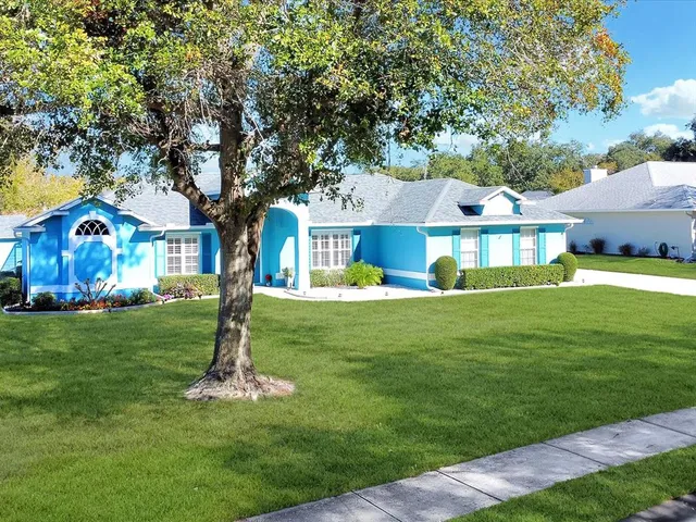 an aerial view of a house with a garden