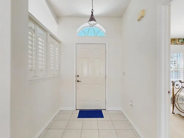 a room that has a window and a table in it