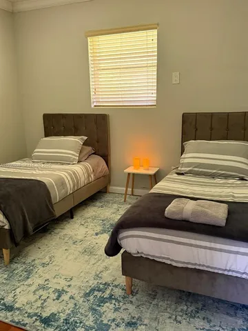 a bedroom with bed and window