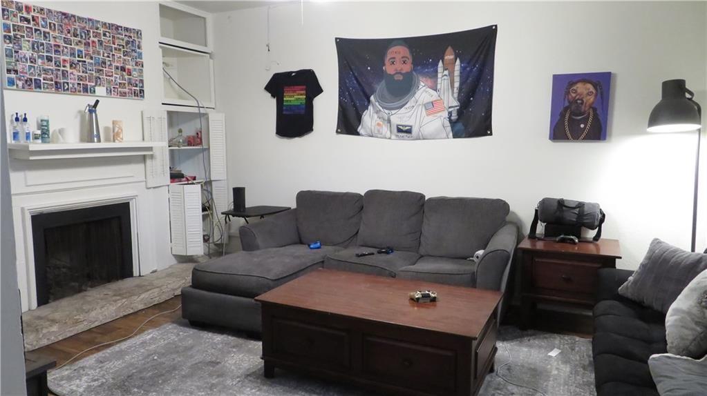 2529 Rio Grande Street, Unit 70 Austin, TX 78705 - Photo 2 of 4 a living room with furniture and a fireplace