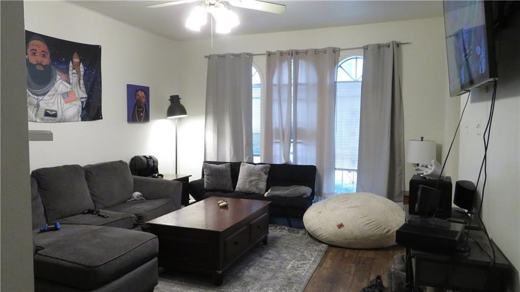 2529 Rio Grande Street, Unit 70 Austin, TX 78705 - Photo 3 of 4 a living room with furniture and a large window