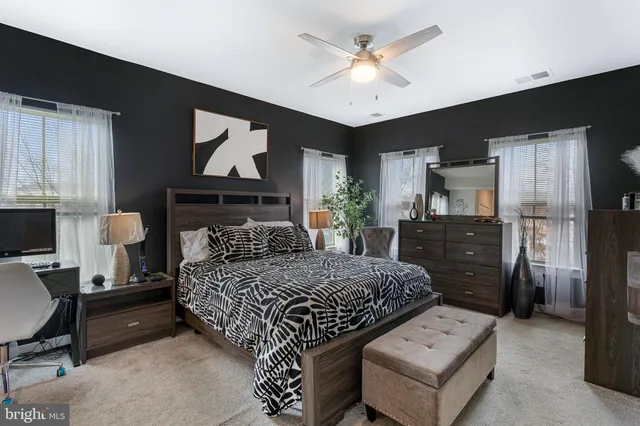 a bedroom with a bed and chair