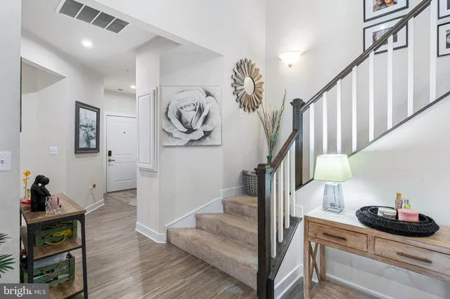 a living room with furniture a piano and a window