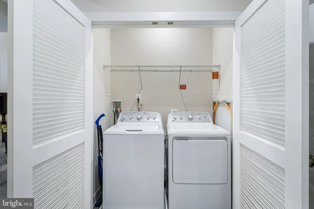 a bedroom with bed and cabinet