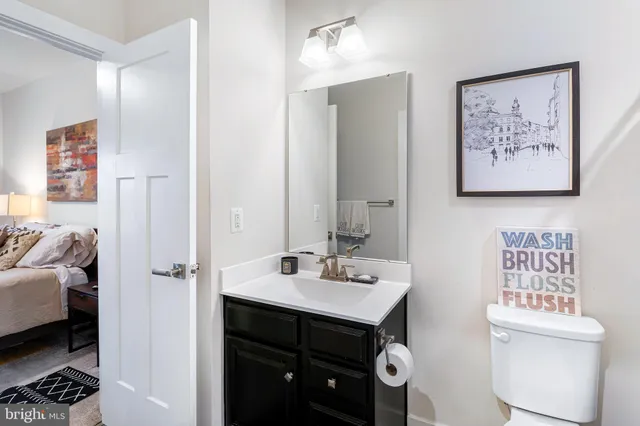 a picture of a bench in front of a wall