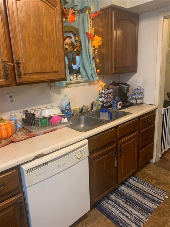 451 Delaware Avenue Rochester, PA 15074 - Photo 12 of 19 a kitchen with stainless steel appliances granite countertop a sink a stove and cabinets