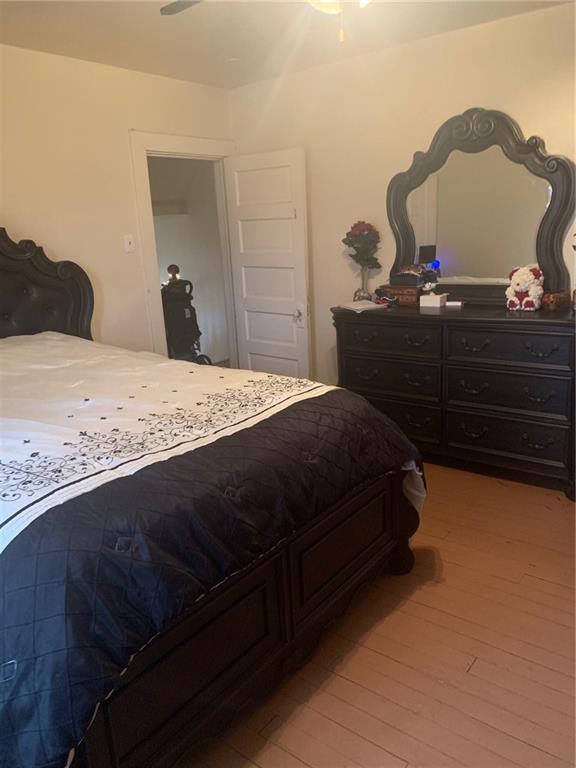 451 Delaware Avenue Rochester, PA 15074 - Photo 15 of 19 a bedroom with a bed and a cabinets