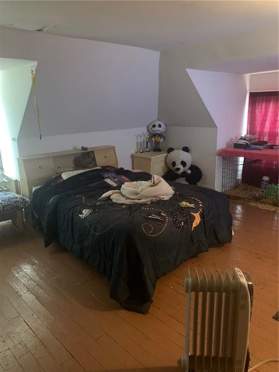 451 Delaware Avenue Rochester, PA 15074 - Photo 18 of 19 a bed sitting in a bedroom next to a window with fireplace