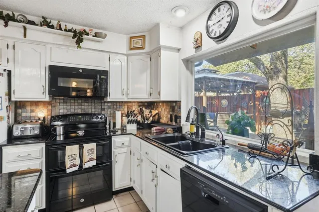 a kitchen with a stove and a microwave
