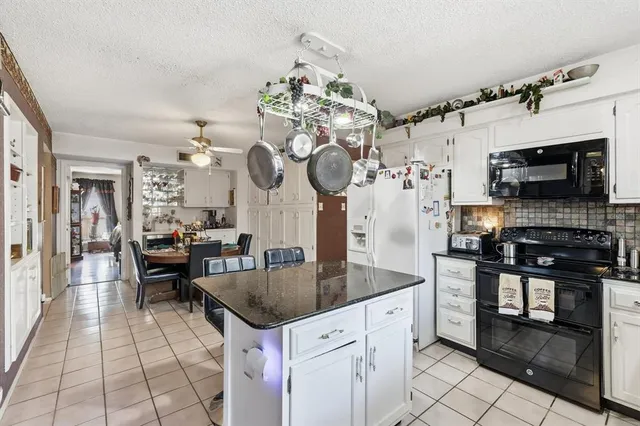 a bed room with a bed and a large window