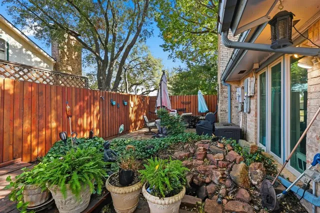 a outdoor living space with furniture and umbrella