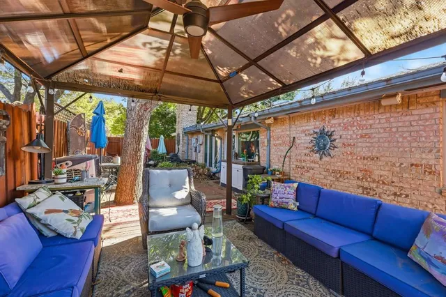 a swimming pool with outdoor seating and yard