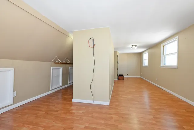 a view of empty room with a fireplace