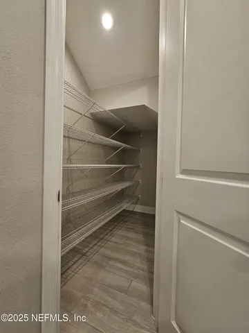 a view of staircase with wooden floor
