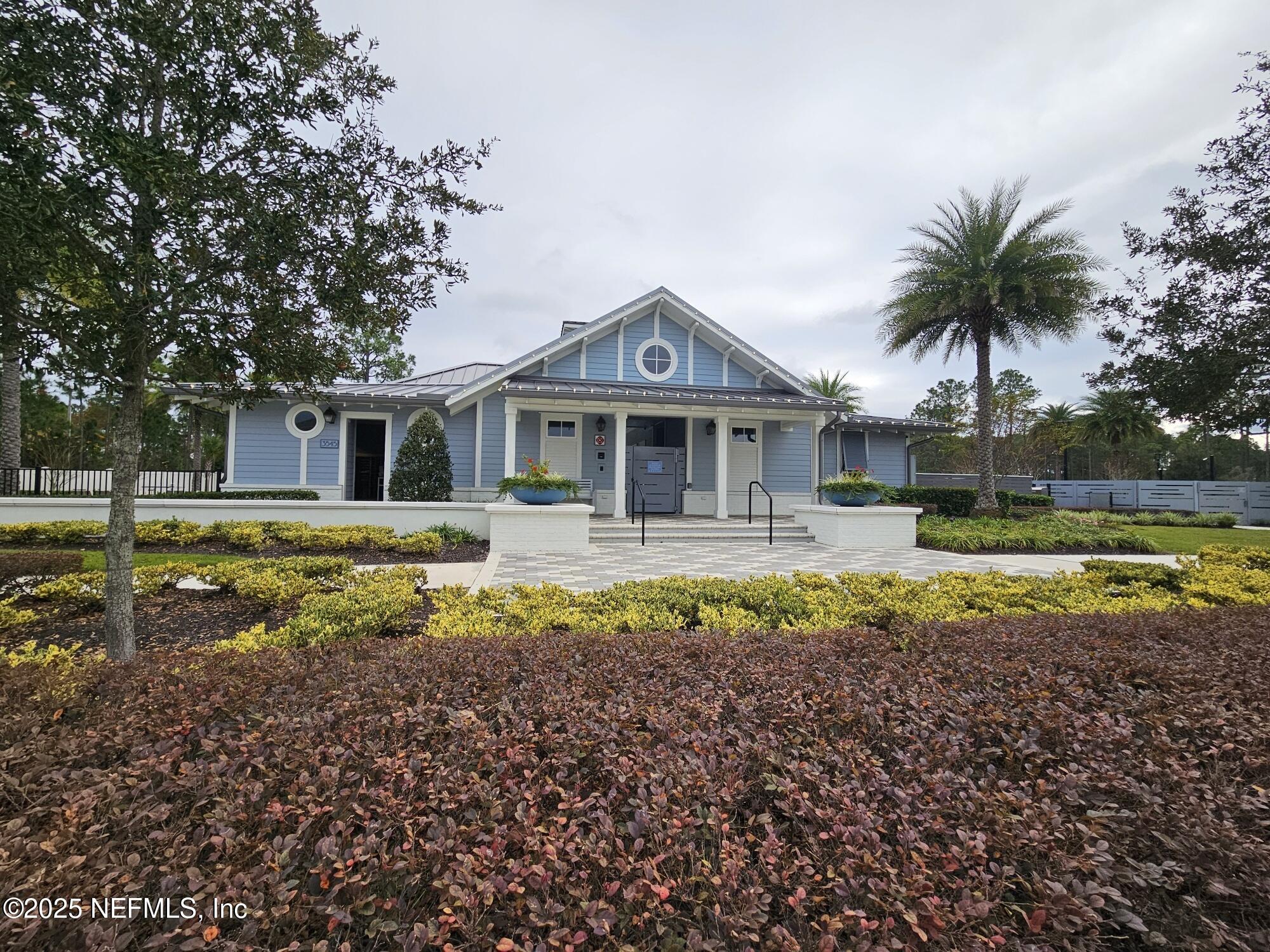 3434 Marsh Reserve Boulevard Jacksonville, FL 32224 - Photo 35 of 39 a front view of a house with swimming pool and porch with furniture