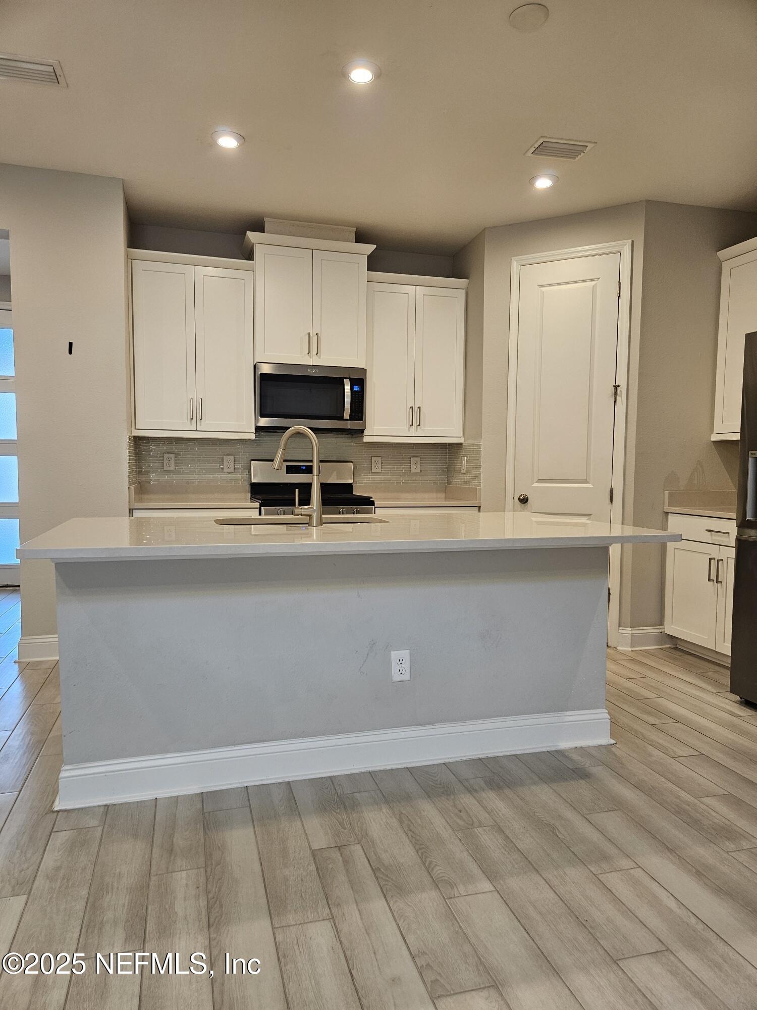 3434 Marsh Reserve Boulevard Jacksonville, FL 32224 - Photo 4 of 39 kitchen island