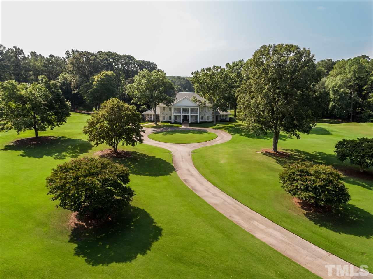 4613 Stormy Gale Road Raleigh, NC 27614 - Photo 2 of 30 a view of a garden with a lake