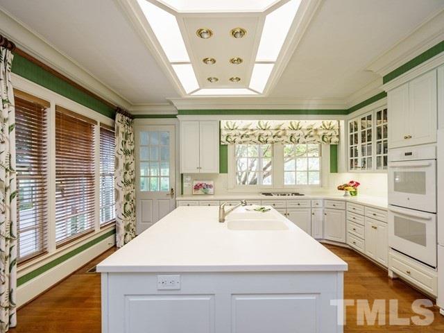 4613 Stormy Gale Road Raleigh, NC 27614 - Photo 13 of 30 a kitchen with a sink and large windows