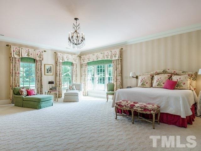 4613 Stormy Gale Road Raleigh, NC 27614 - Photo 15 of 30 a bedroom with a bed and large windows