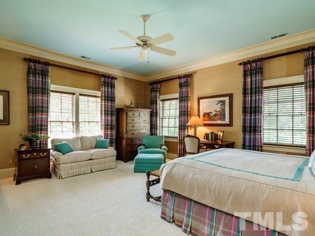 4613 Stormy Gale Road Raleigh, NC 27614 - Photo 19 of 30 a bedroom with a bed a couch and a large window