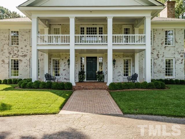 4613 Stormy Gale Road Raleigh, NC 27614 - Photo 3 of 30 front view of a brick house with a yard