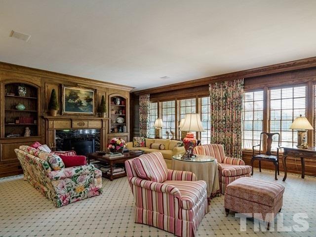 4613 Stormy Gale Road Raleigh, NC 27614 - Photo 8 of 30 a living room with furniture fireplace and large window