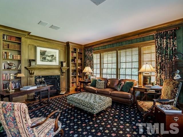 4613 Stormy Gale Road Raleigh, NC 27614 - Photo 10 of 30 a bedroom with furniture and a fireplace