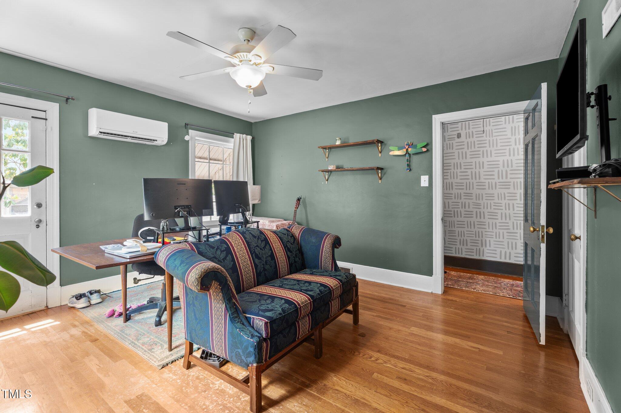 925 South Chestnut Street Henderson, NC 27536 - Photo 13 of 28 a living room with furniture and a flat screen tv
