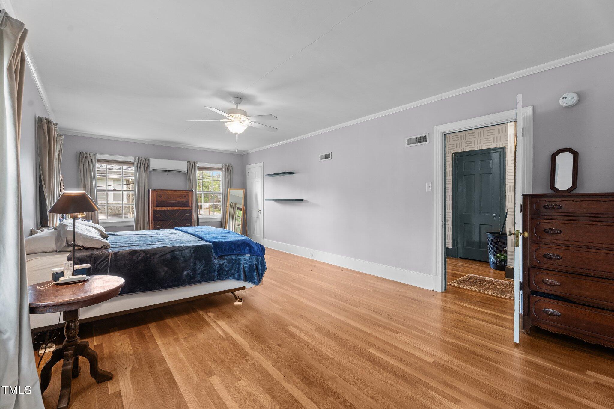 925 South Chestnut Street Henderson, NC 27536 - Photo 15 of 28 a spacious bedroom with a bed and a table