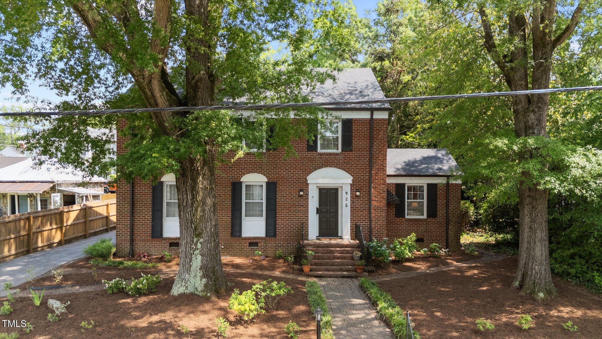 925 South Chestnut Street Henderson, NC 27536 - Photo 21 of 28 a front view of a house with a yard