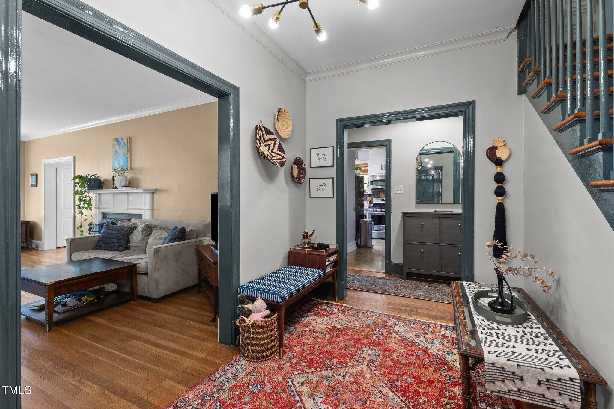 925 South Chestnut Street Henderson, NC 27536 - Photo 3 of 28 a living room with furniture and a rug