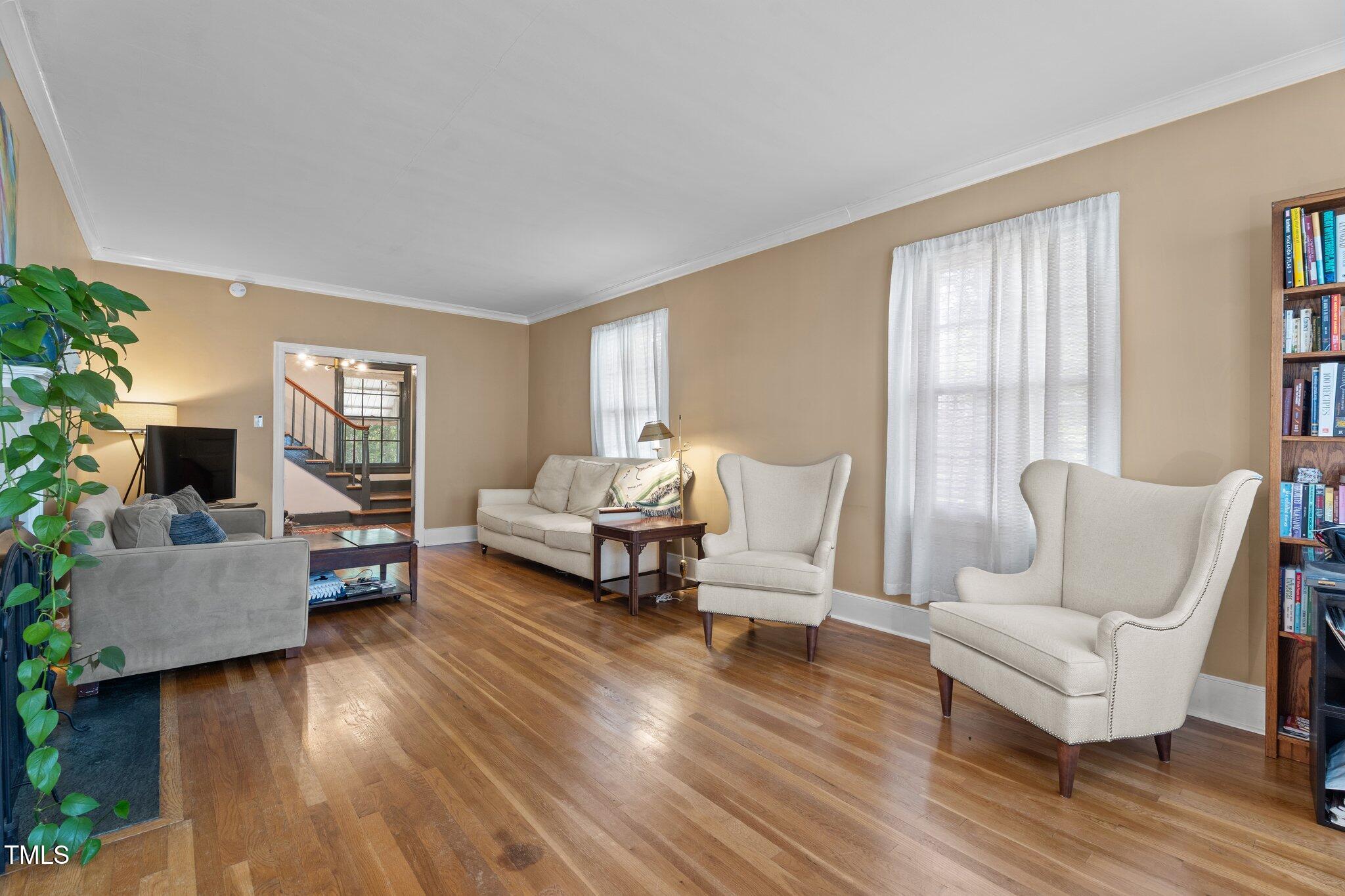 925 South Chestnut Street Henderson, NC 27536 - Photo 5 of 28 a living room with furniture and a fireplace