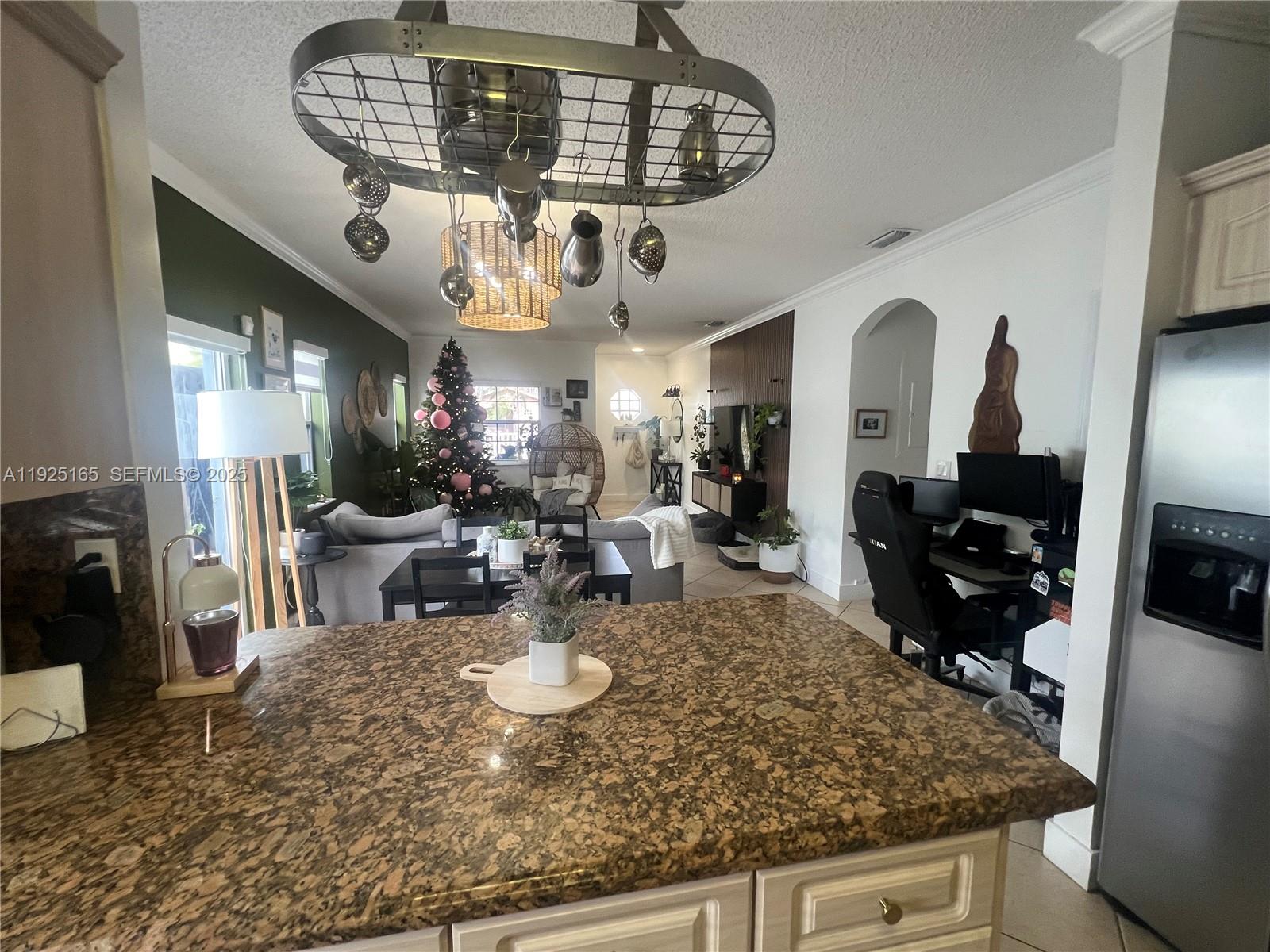 12446 Southwest 198th Street Miami, FL 33177 - Photo 13 of 56 a kitchen with a table and chairs in it