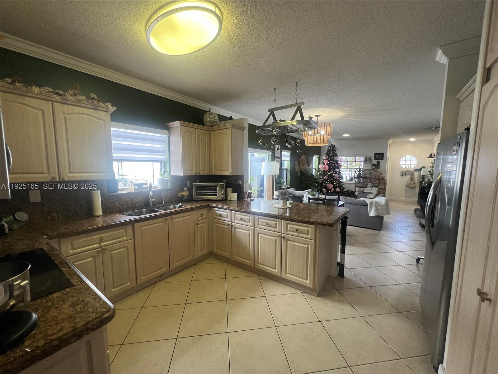 12446 Southwest 198th Street Miami, FL 33177 - Photo 20 of 56 a kitchen with a sink cabinets and window
