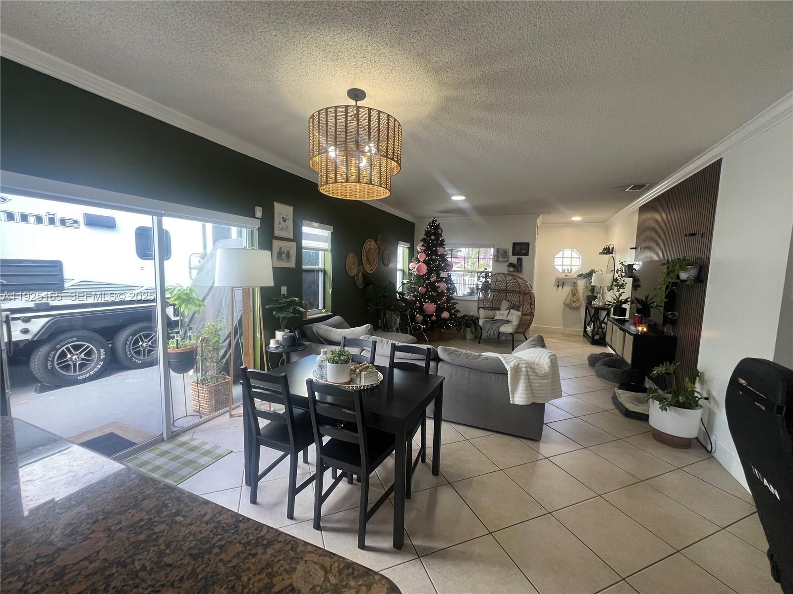 12446 Southwest 198th Street Miami, FL 33177 - Photo 2 of 56 a view of a dining room with furniture