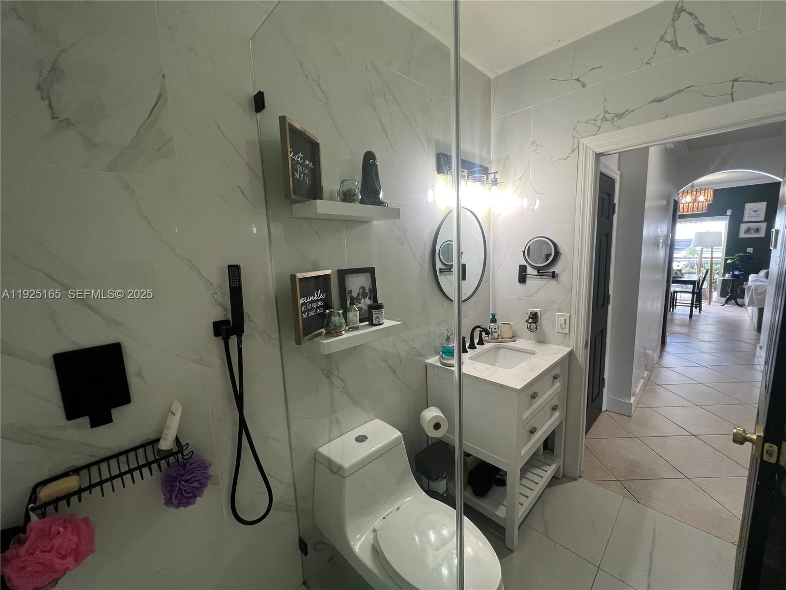 12446 Southwest 198th Street Miami, FL 33177 - Photo 26 of 56 a living room with furniture and a flat screen tv