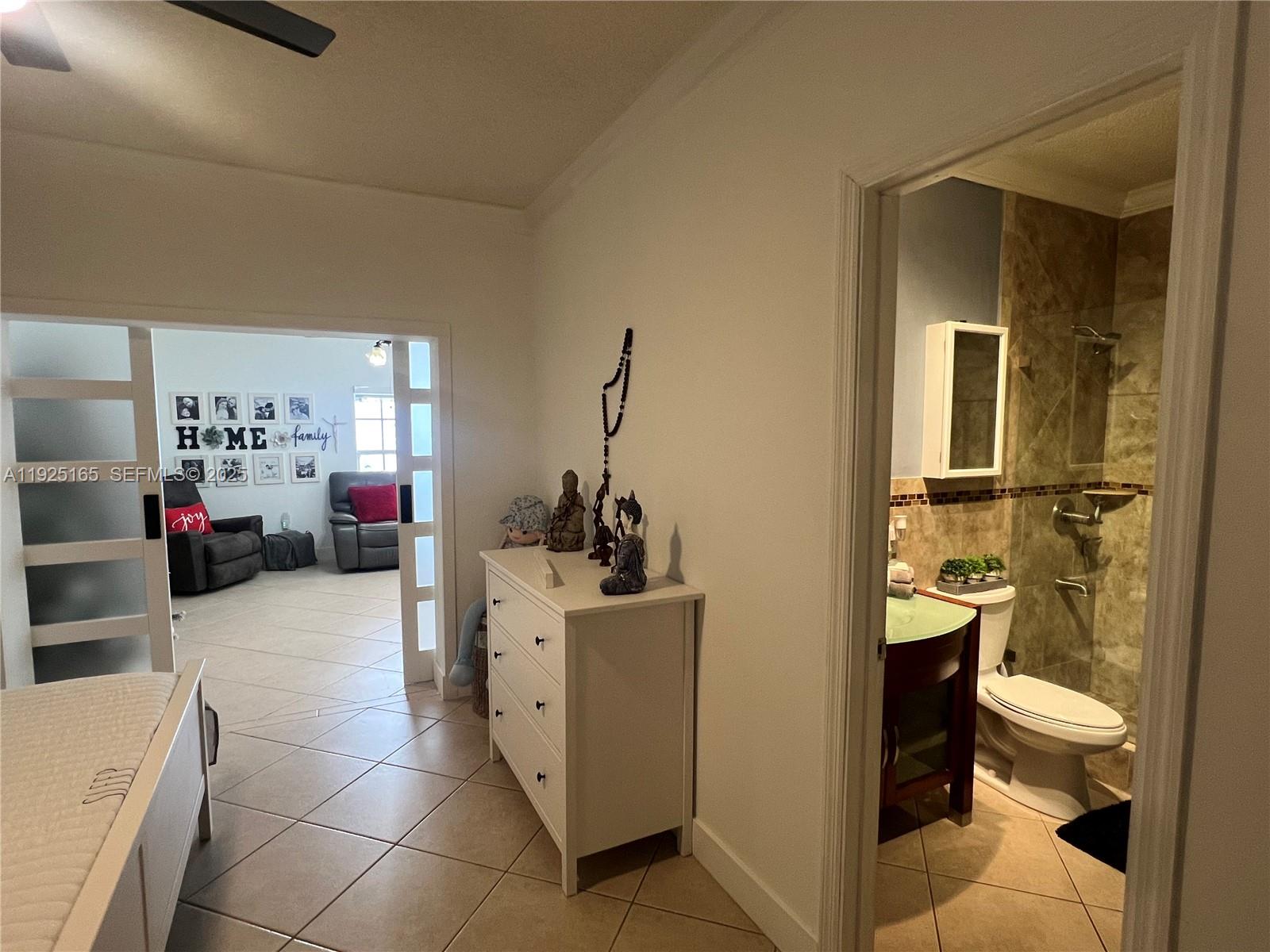 12446 Southwest 198th Street Miami, FL 33177 - Photo 46 of 56 a room with a washing machine and a wooden floor