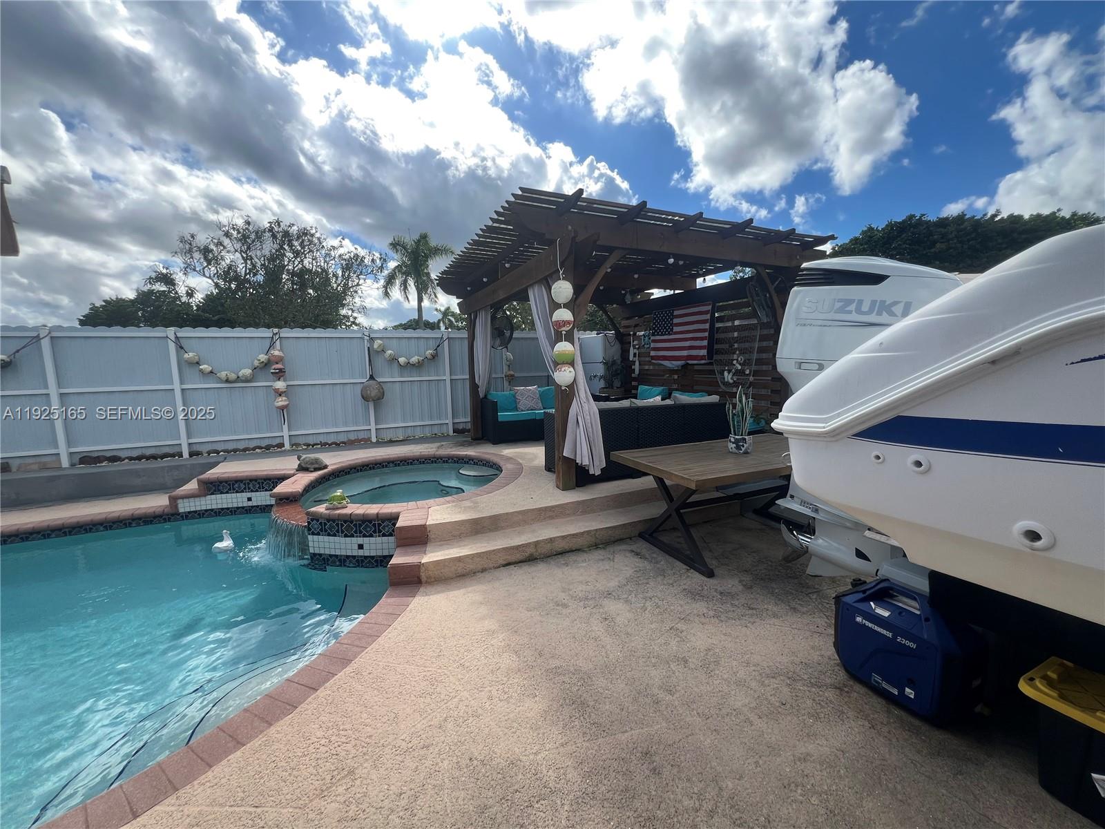 12446 Southwest 198th Street Miami, FL 33177 - Photo 56 of 56 a view of a backyard with a patio