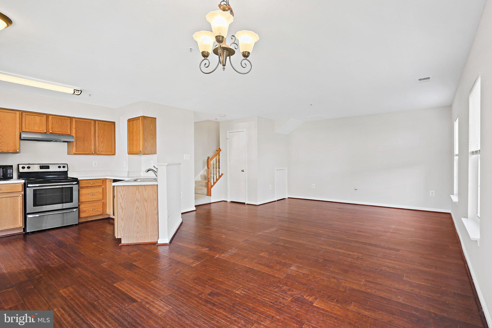 5016 Croydon Terrace Frederick, MD 21703 - Photo 11 of 34 a view of kitchen with wooden floor and stainless steel appliances