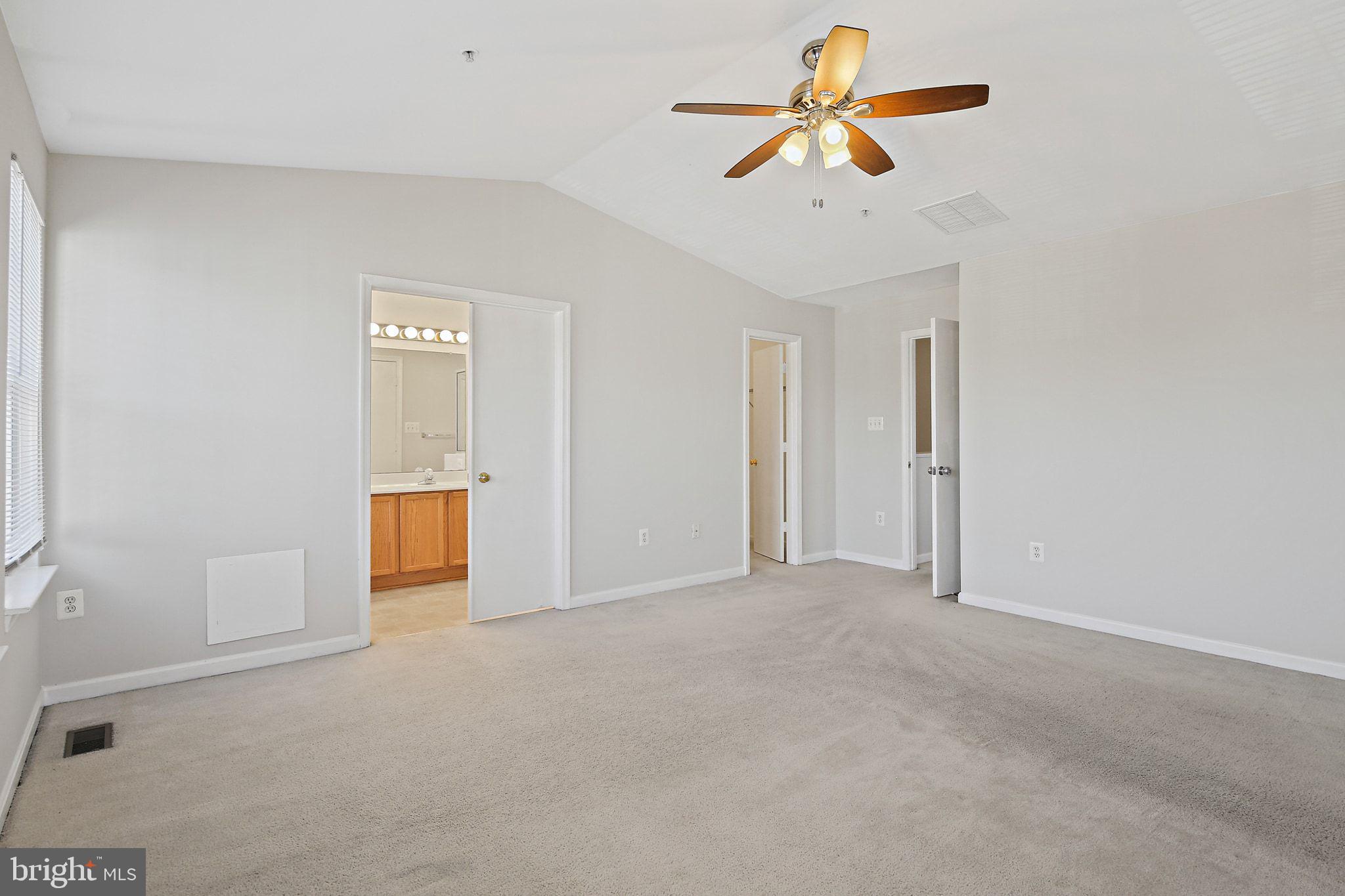 5016 Croydon Terrace Frederick, MD 21703 - Photo 18 of 34 a view of a room with a ceiling fan and a window