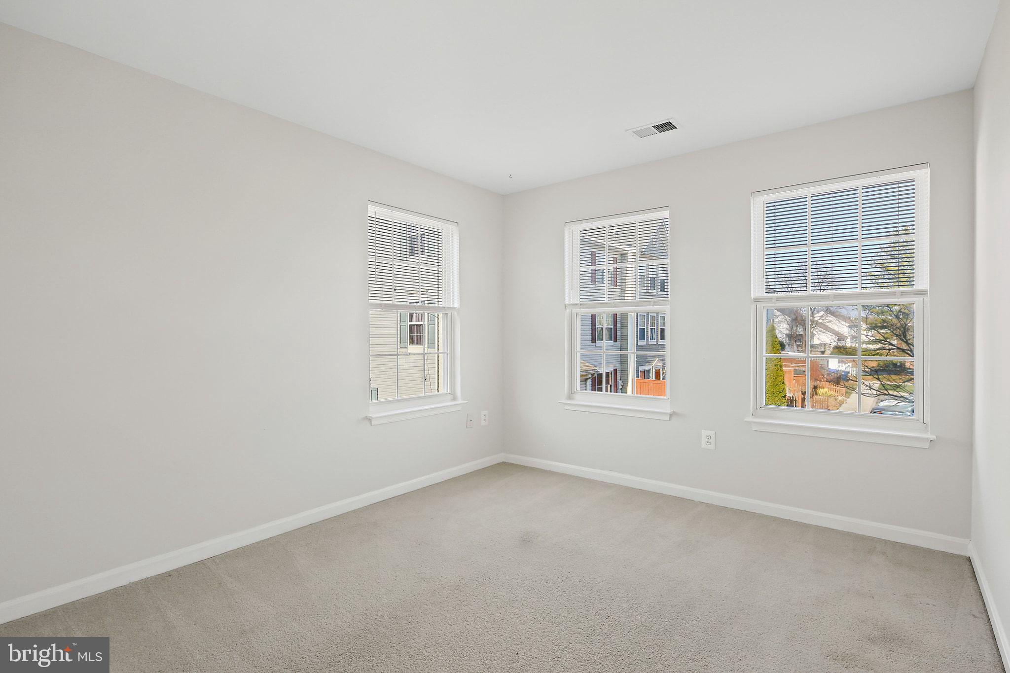 5016 Croydon Terrace Frederick, MD 21703 - Photo 27 of 34 an empty room with windows