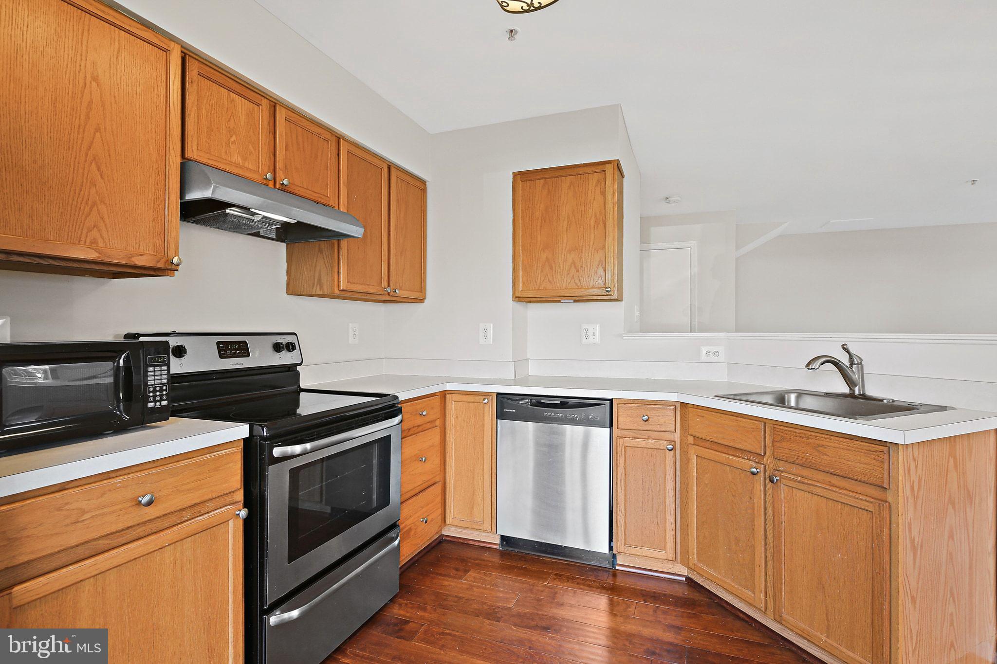 5016 Croydon Terrace Frederick, MD 21703 - Photo 3 of 34 a kitchen with stainless steel appliances granite countertop a sink stove and cabinets