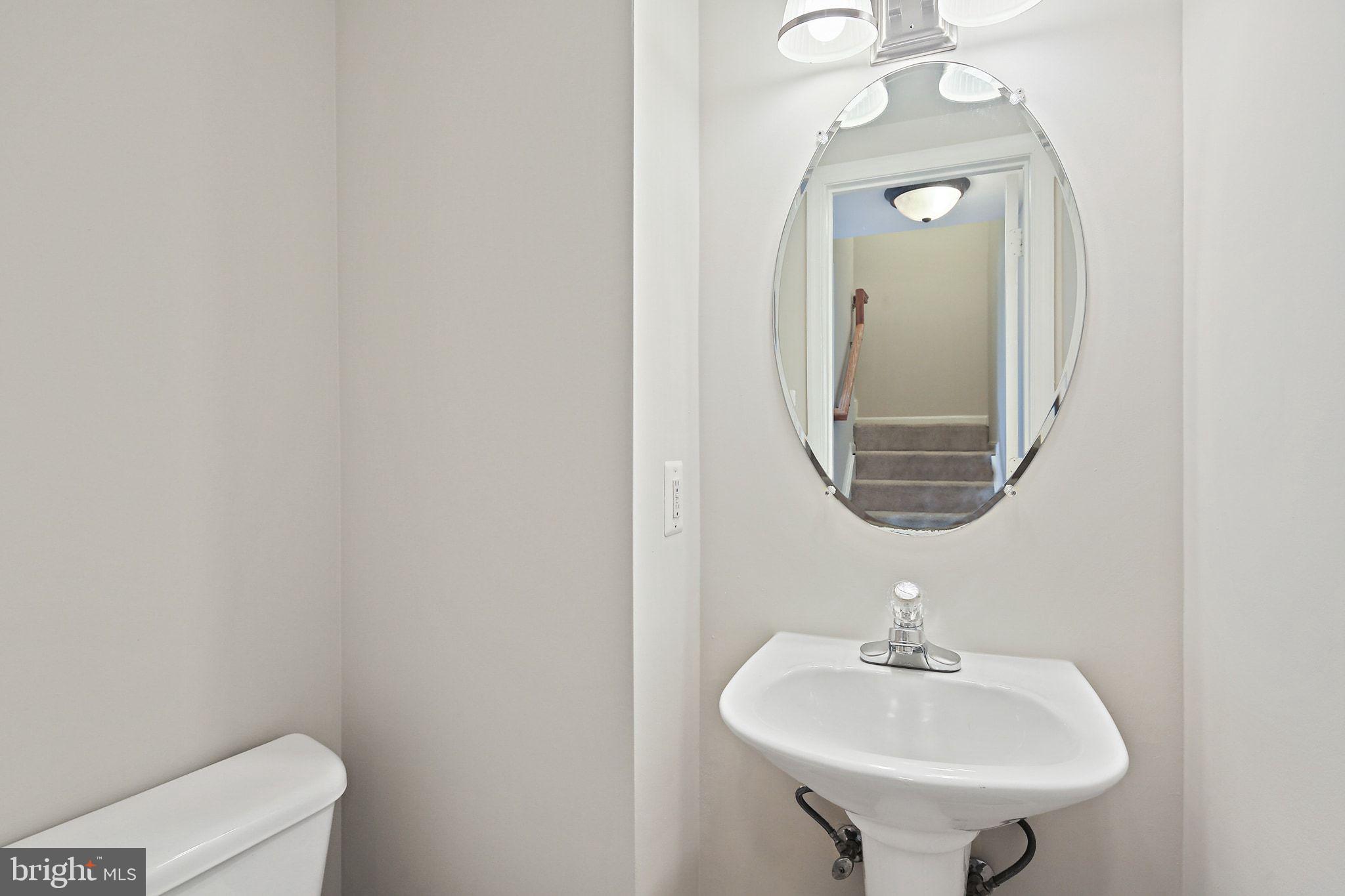 5016 Croydon Terrace Frederick, MD 21703 - Photo 31 of 34 a bathroom with a sink and a mirror