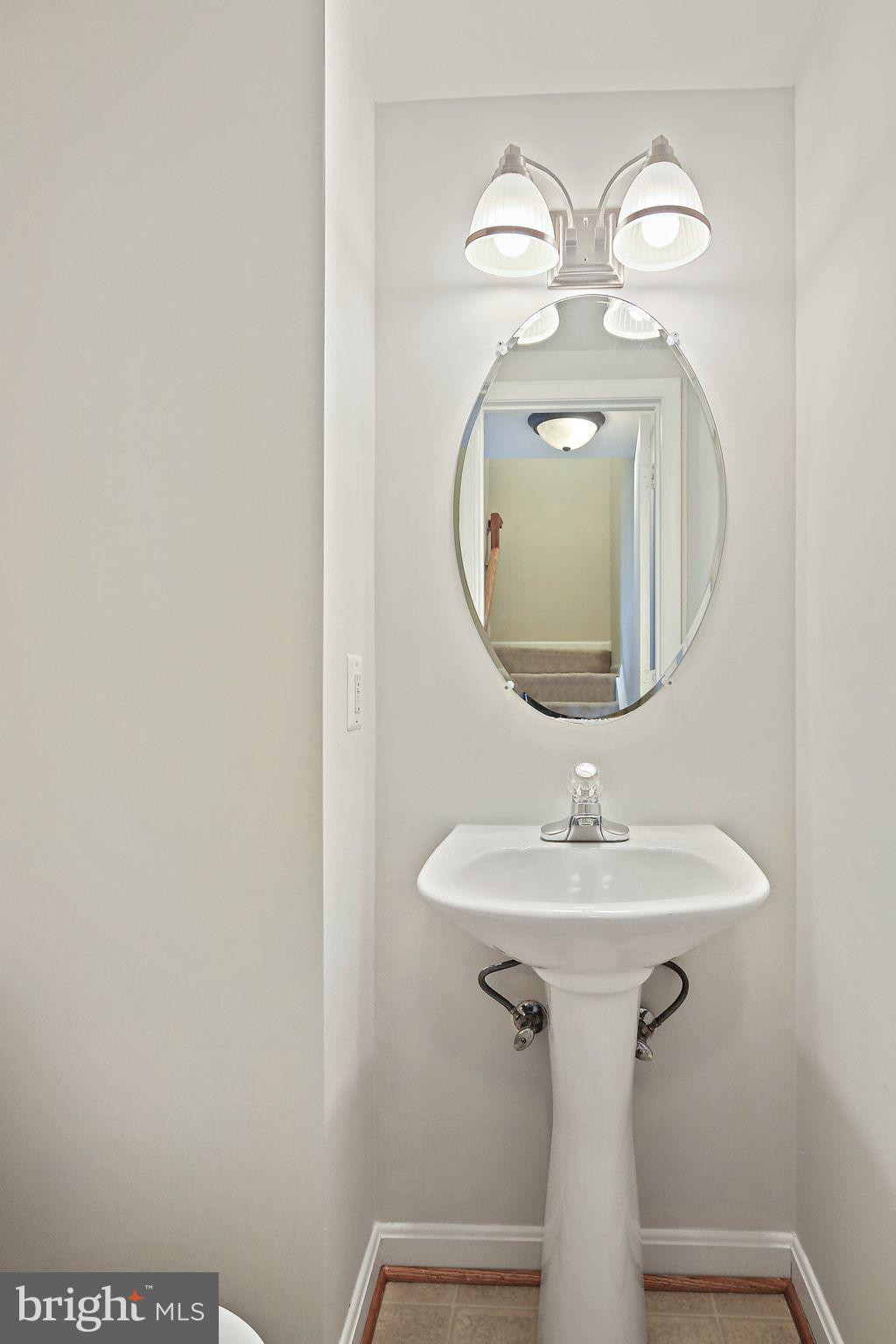 5016 Croydon Terrace Frederick, MD 21703 - Photo 32 of 34 a bathroom with a sink and mirror