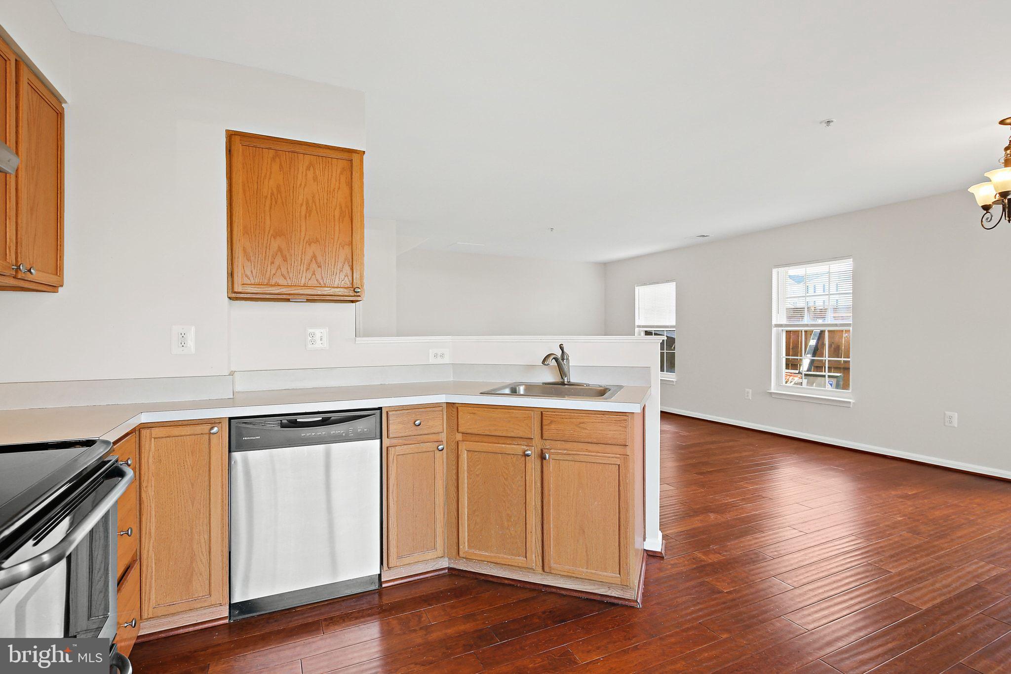5016 Croydon Terrace Frederick, MD 21703 - Photo 5 of 34 a view of a kitchen with wooden floor and electronic appliances