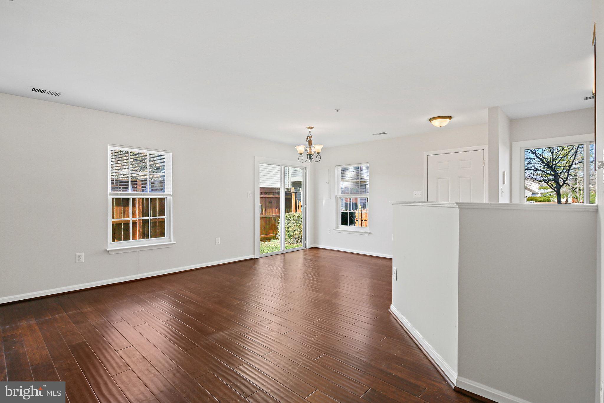 5016 Croydon Terrace Frederick, MD 21703 - Photo 9 of 34 a view of empty room with wooden floor and window