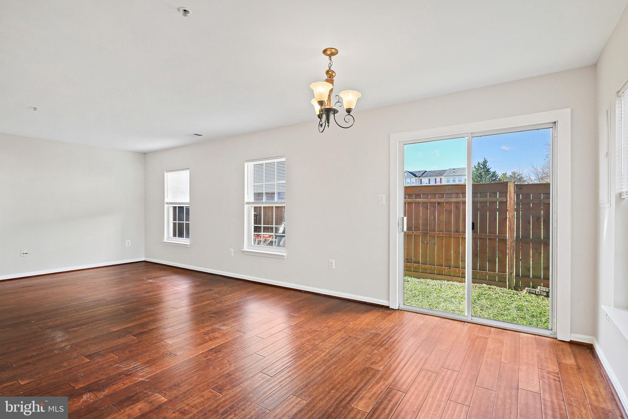 5016 Croydon Terrace Frederick, MD 21703 - Photo 10 of 34 a view of a livingroom with wooden floor and a window