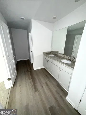 a kitchen with a sink stove and refrigerator