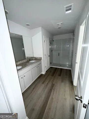 a view of a kitchen from a hallway