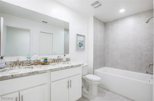 a bedroom with a bed and a closet